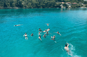 Tillo team swimming in the sea, Croatia